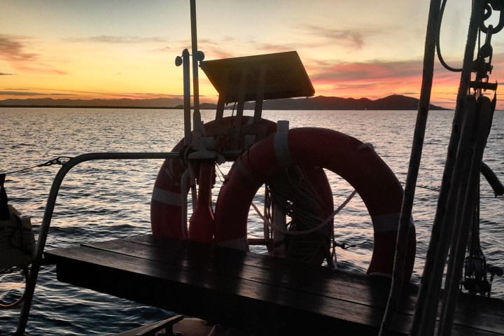 a wooden boat in a body of water