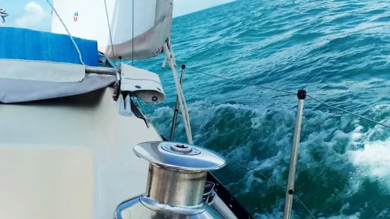 Close photo of white boat sailing