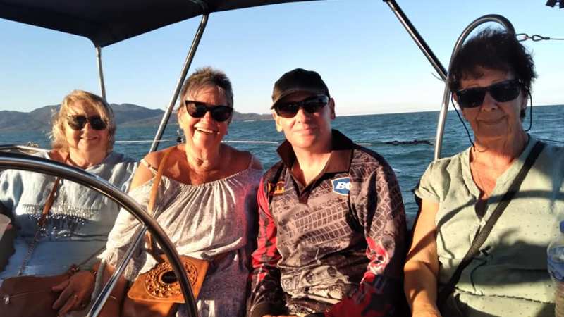 a group of people in a boat on a body of water