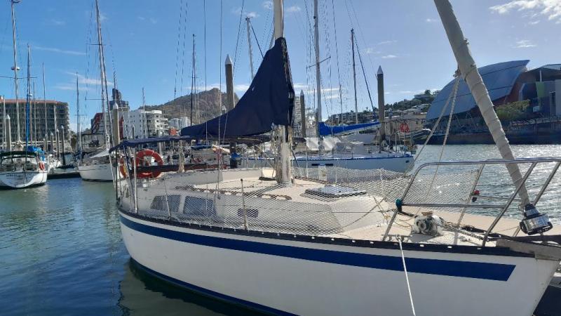 a boat is docked next to a body of water