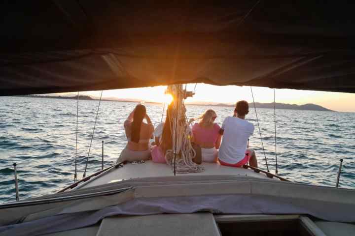 a person sitting on a boat in the water