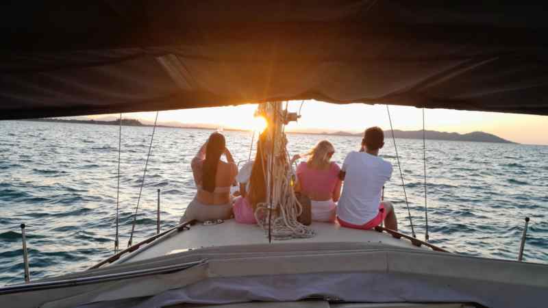 a person sitting on a boat in the water