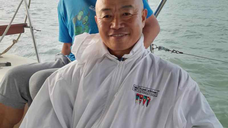 a man sitting on a boat in the water