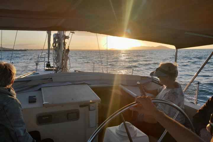 a person sitting on a boat in the water